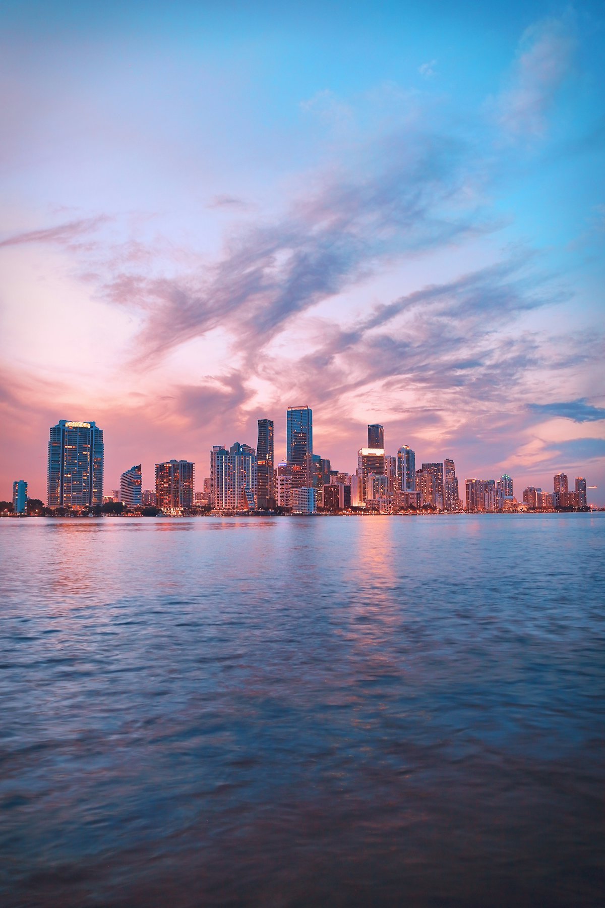 Miami skyline at sunset over the water